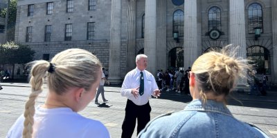 DoDublin Walking Tour man standing in front of building with pillars
