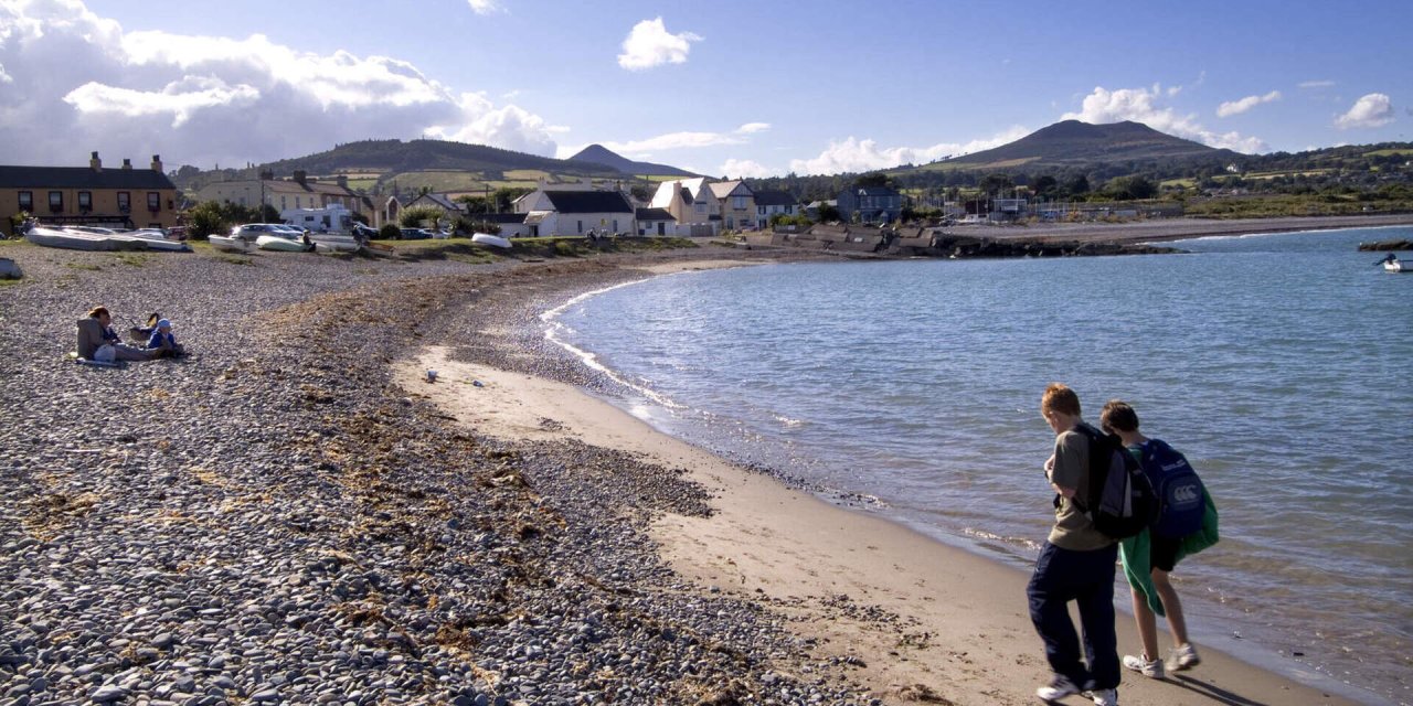 stoney beach beside water 