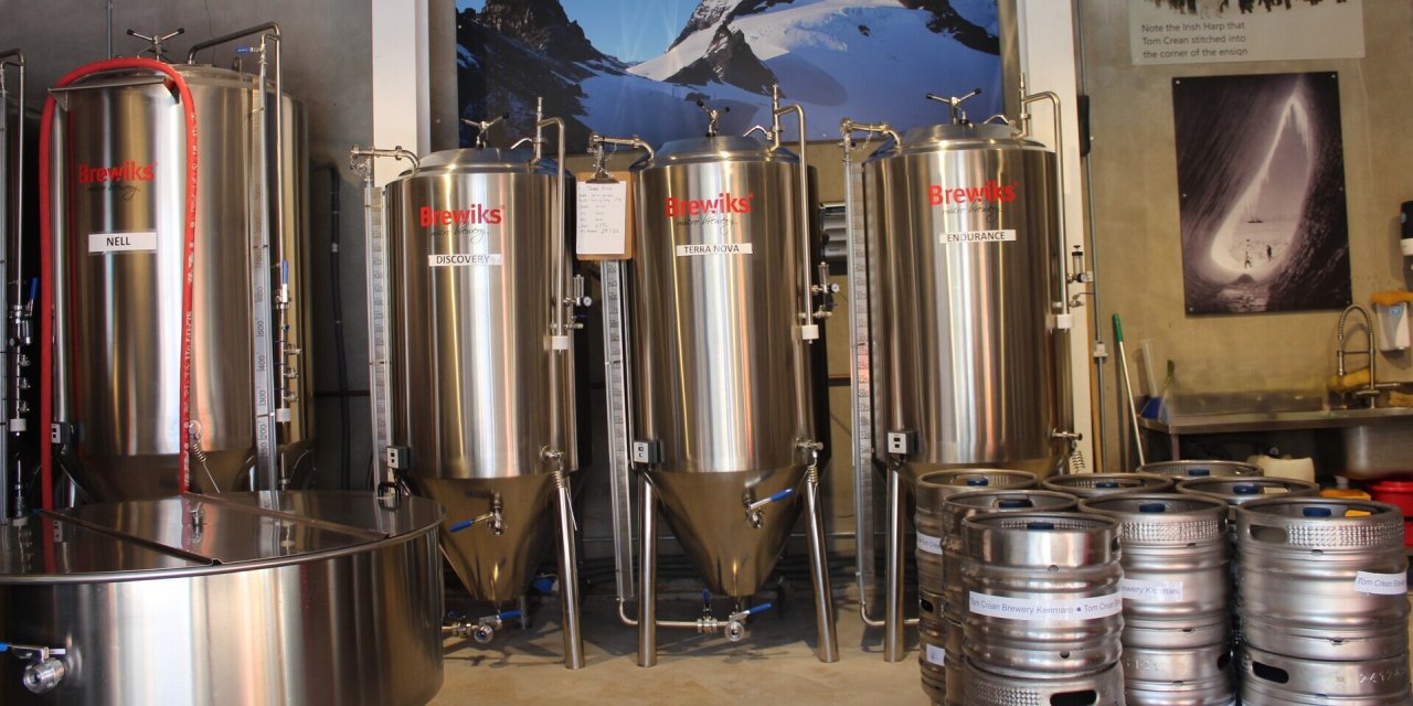 steel cyclinders beside kegs